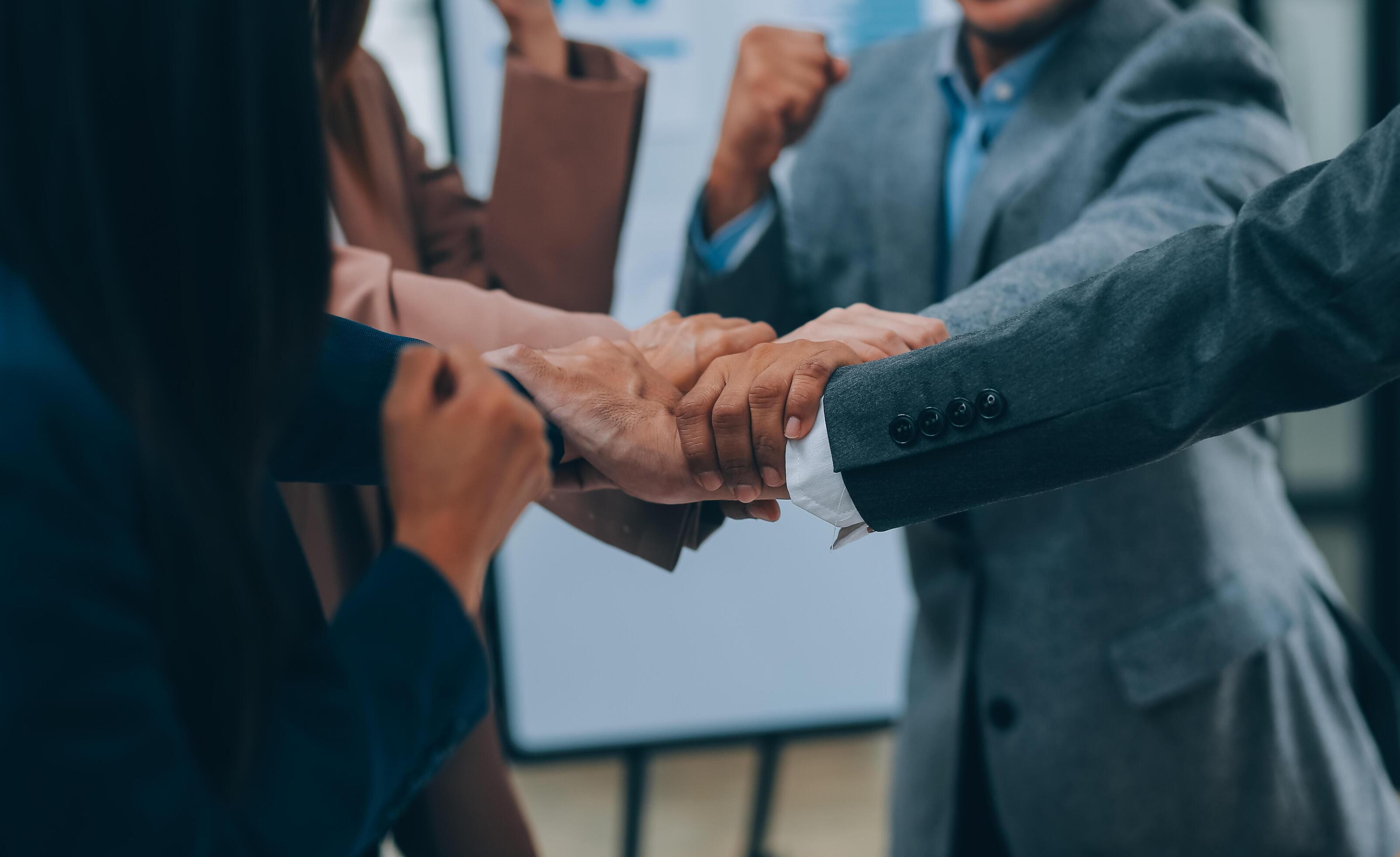 Business people join hand together during their meeting Stock Free