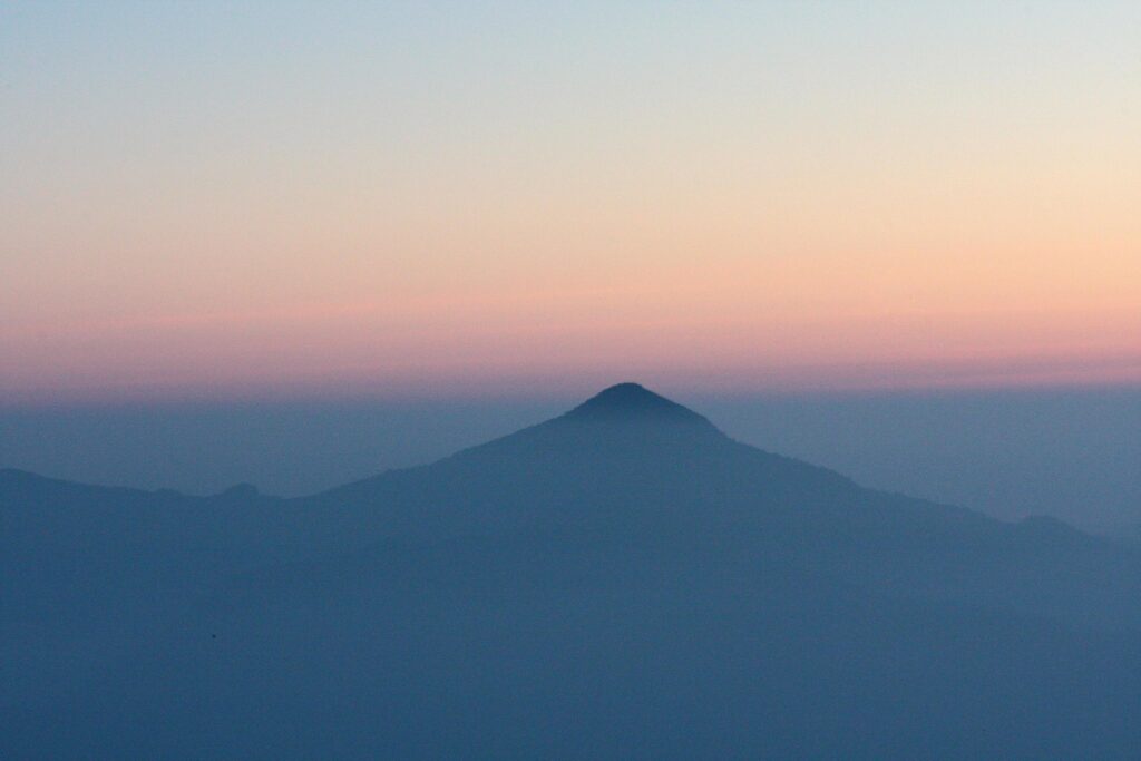 Beautiful golden natural sunlight and twiligh of sunrise shining to in the mist on valley of mountain Stock Free