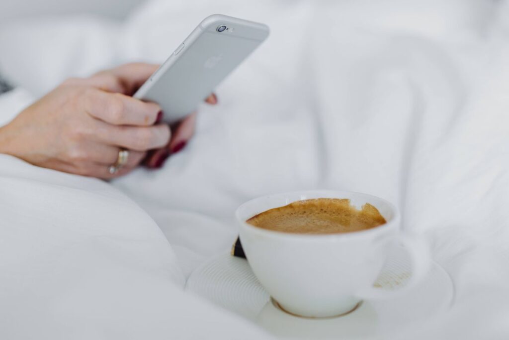 Morning coffee with chocolate in bed Stock Free