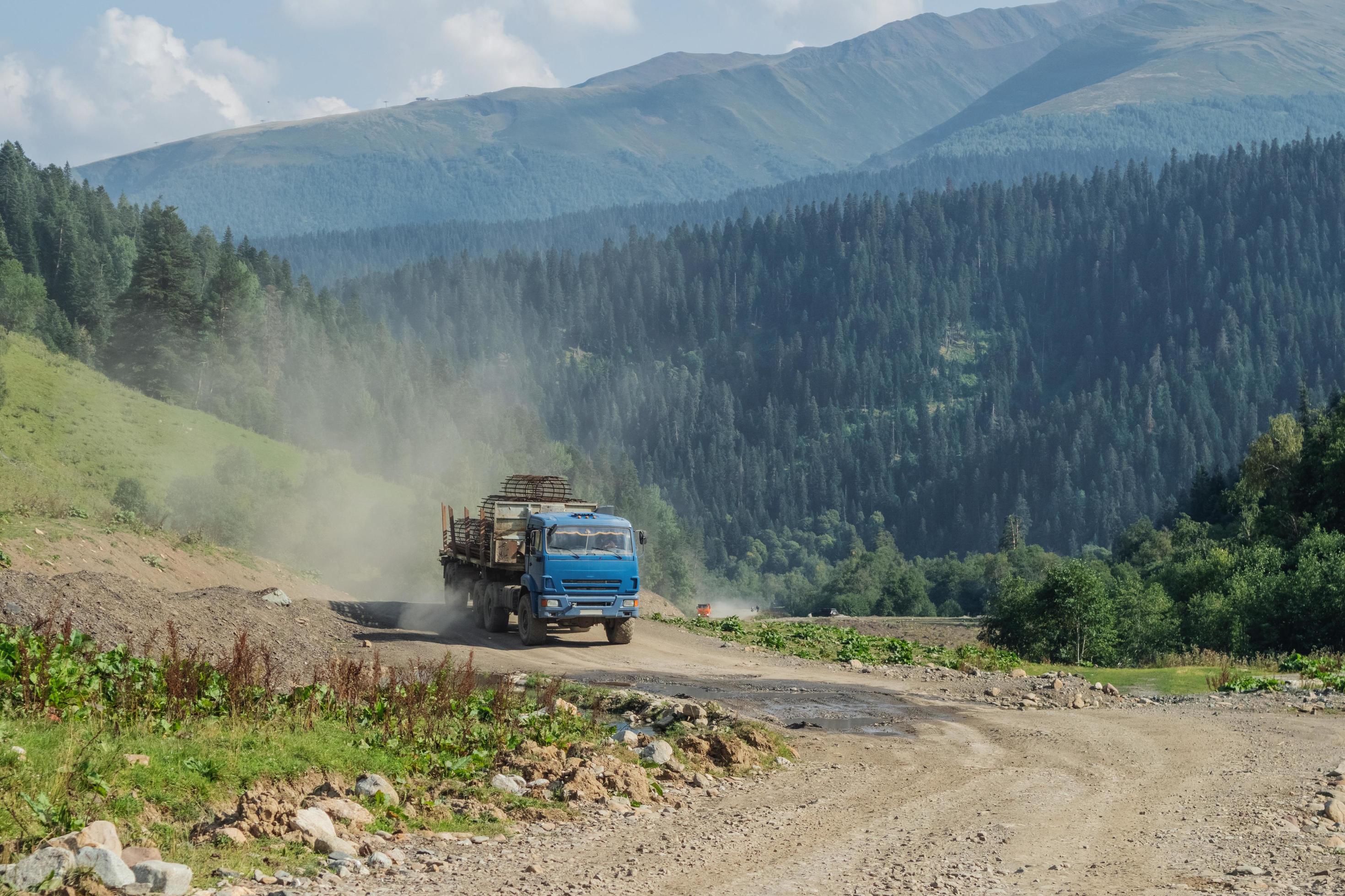 A truck transports a frame made of reinforcement for the construction of concrete poles. Stock Free