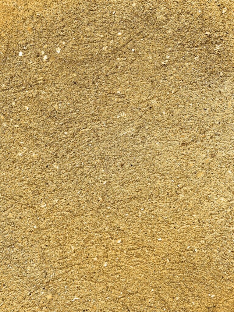 close up of yellow stone wall Stock Free