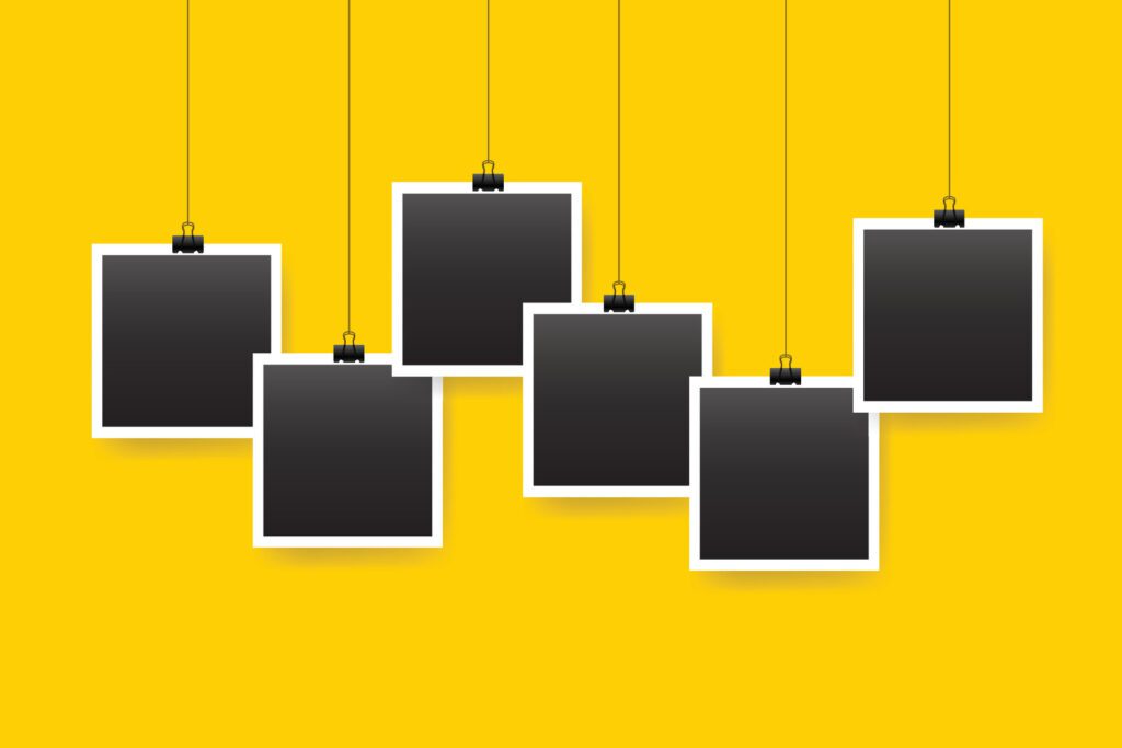 Six hanging photo frames on yellow background Free Vector