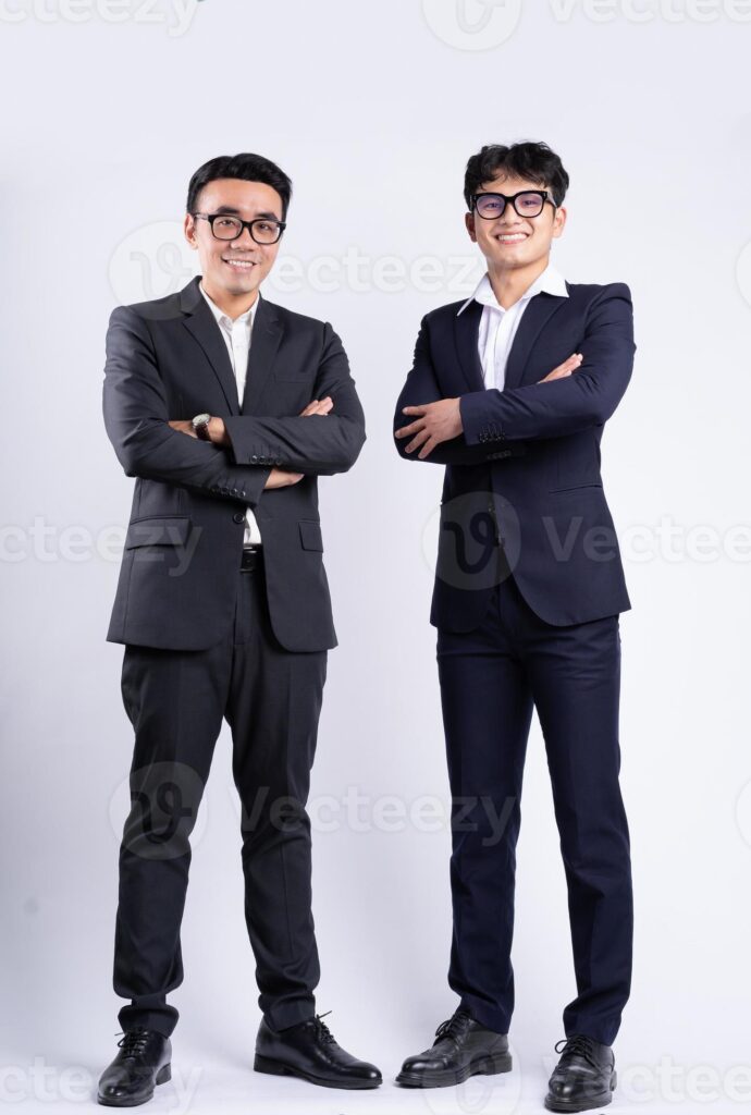 Two Asian businessman posing on white background Pro Photo