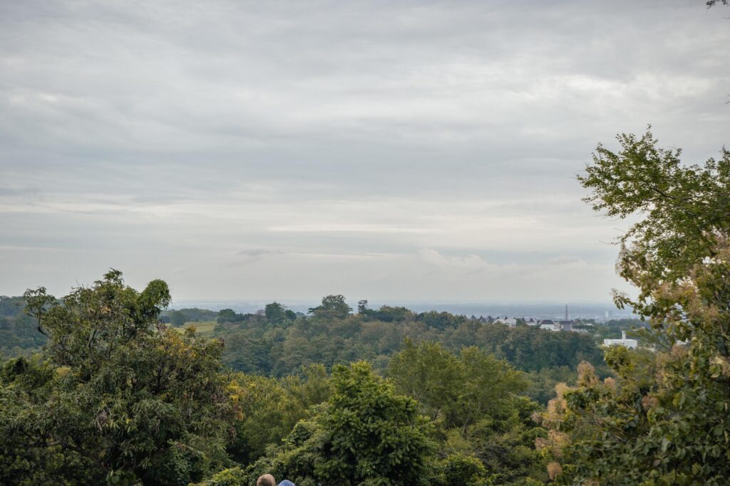 Landscape of hilltop with cloudy vibes when rain season. The photo is suitable to use for environment background, nature poster and nature content media. Stock Free