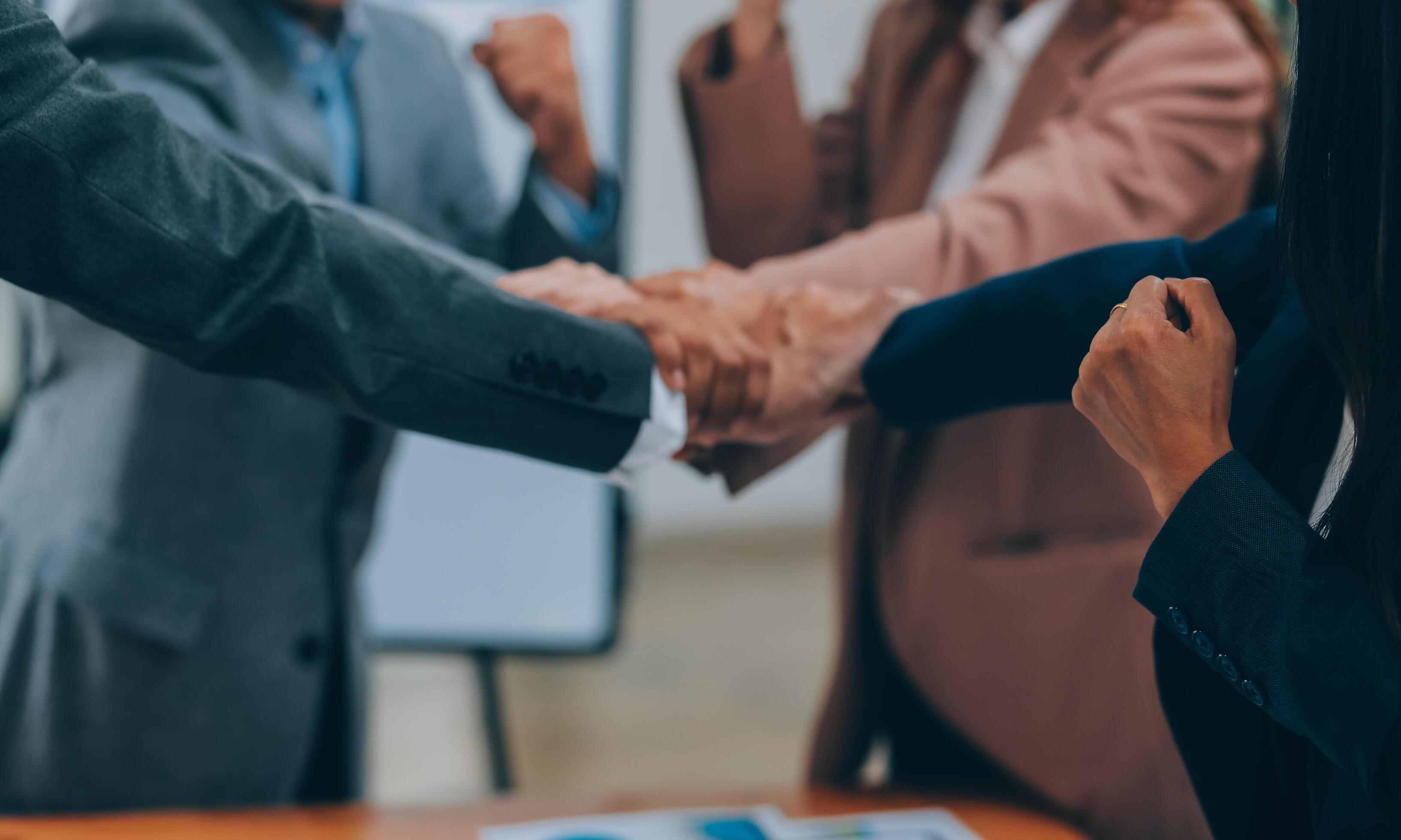 Business people join hand together during their meeting Stock Free