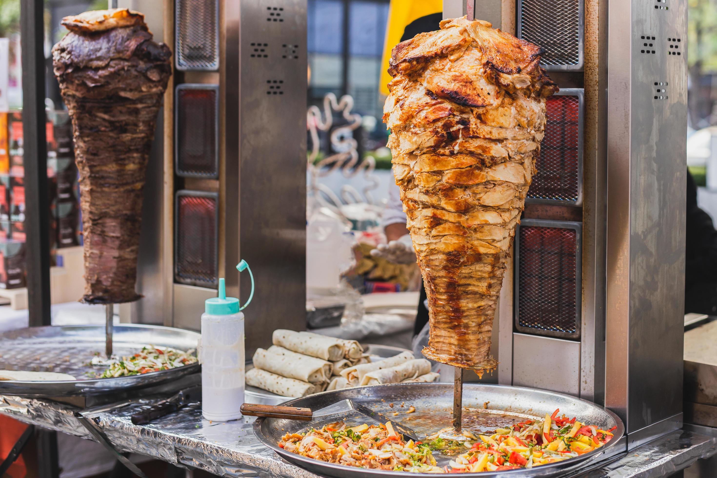 Traditional turkish food chicken doner and beef doner kebab on street vedor. Stock Free