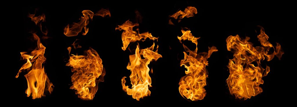 The set of fire and burning flame isolated on dark background for graphic design Stock Free