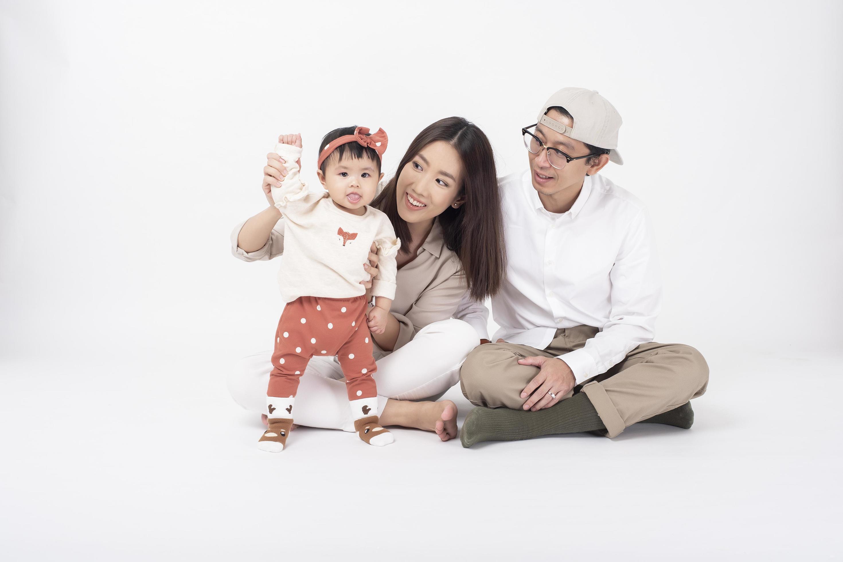 Happy Asian family on white background Stock Free