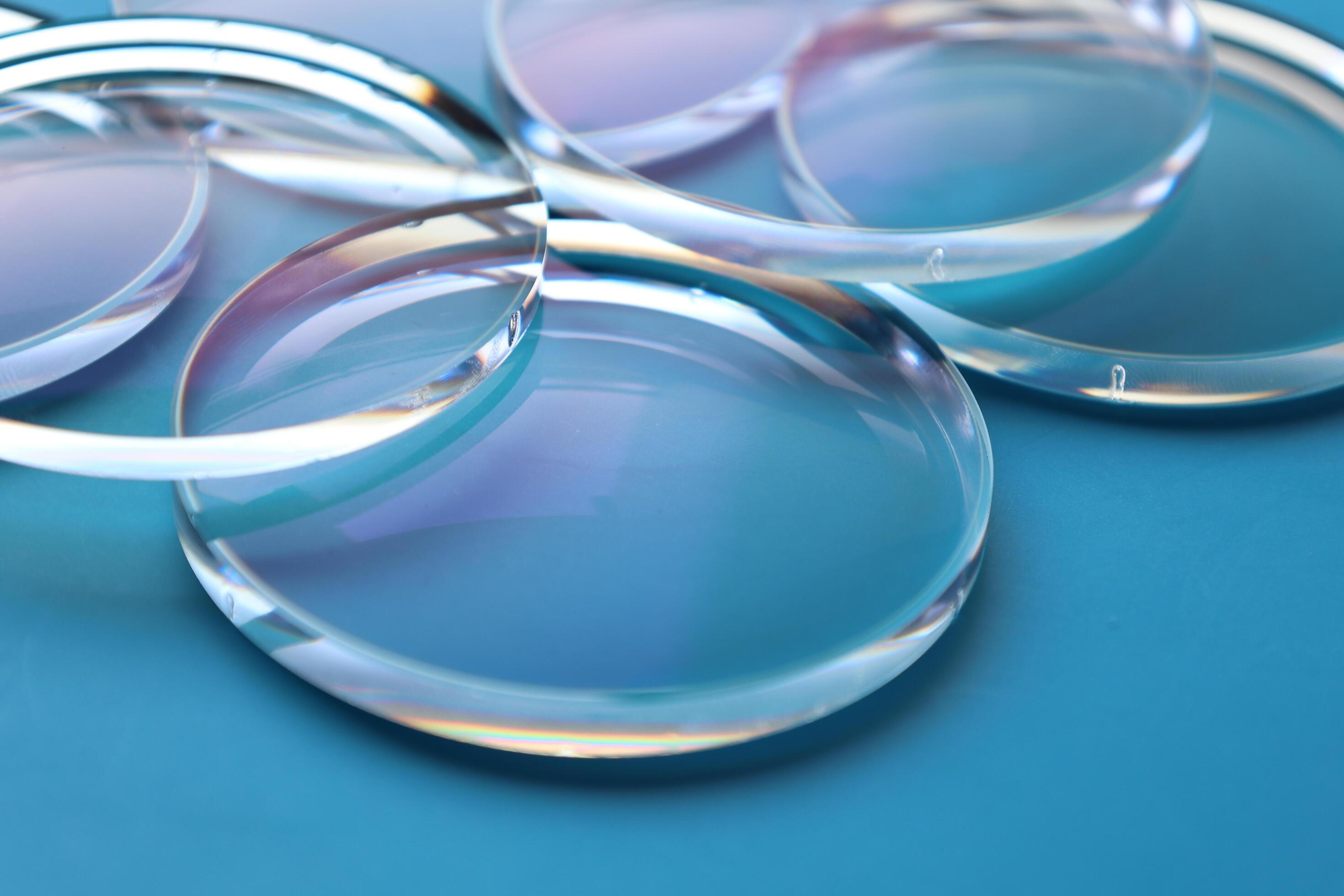 Eyeglasses lens production industry, close-up eyeglasses lenses, eyeglasses lenses, eyeglasses lenses, eyeglasses store business concept Stock Free