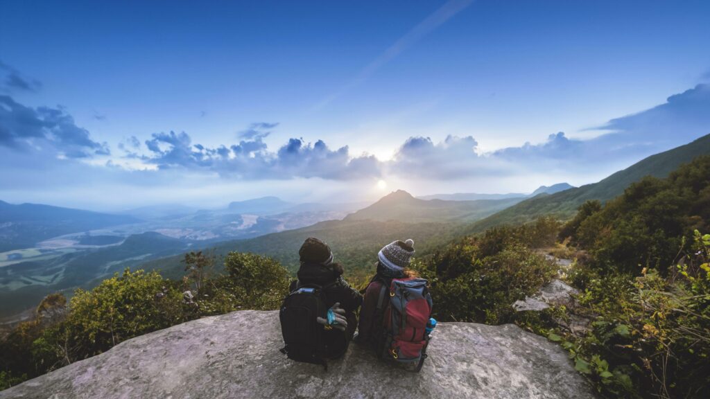 Lover women and men asians travel relax in the holiday. Admire the atmosphere landscape on the Moutain. Mountain Park happily. In Thailand Stock Free