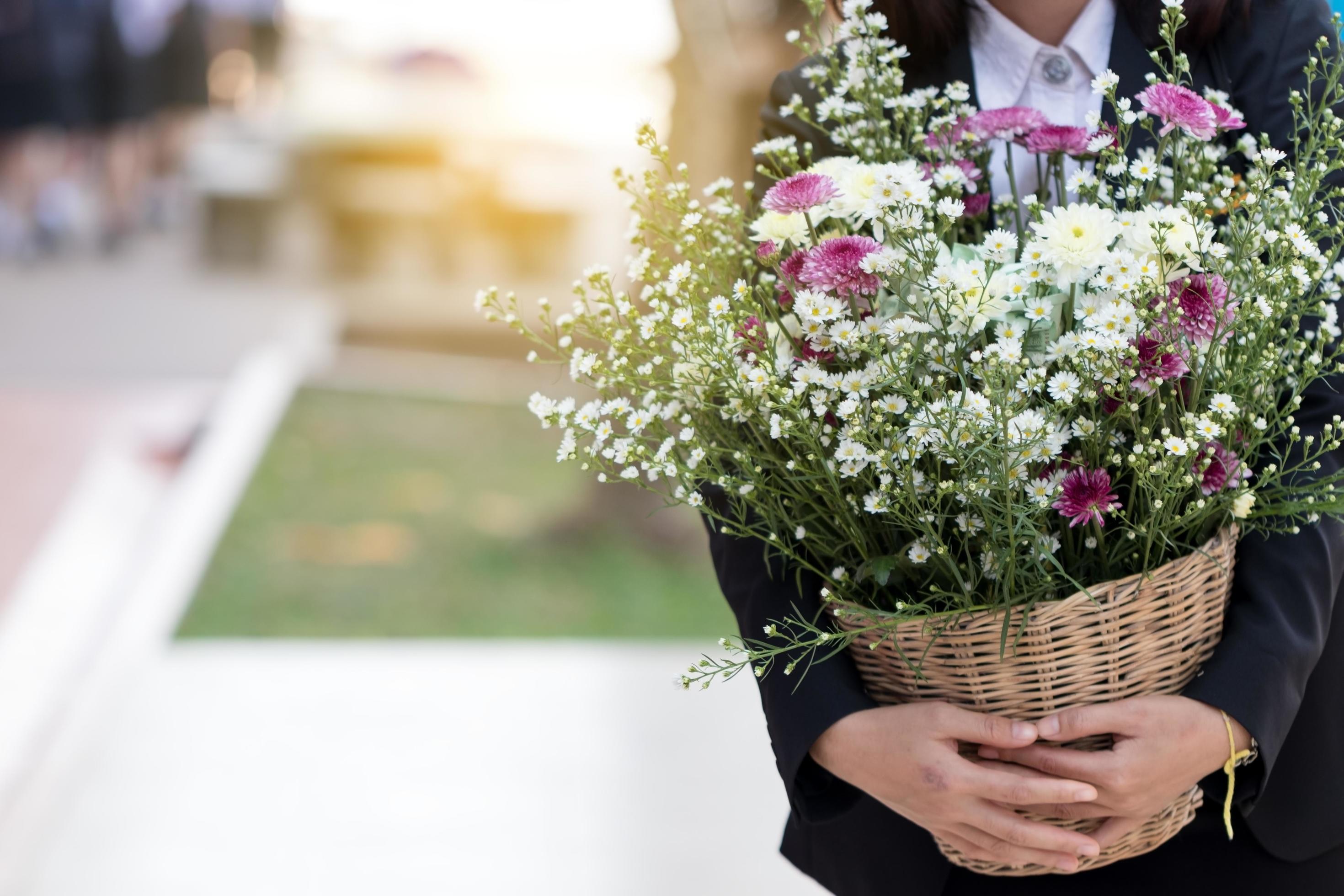 Woman carrying a bouquet of flowers. Stock Free