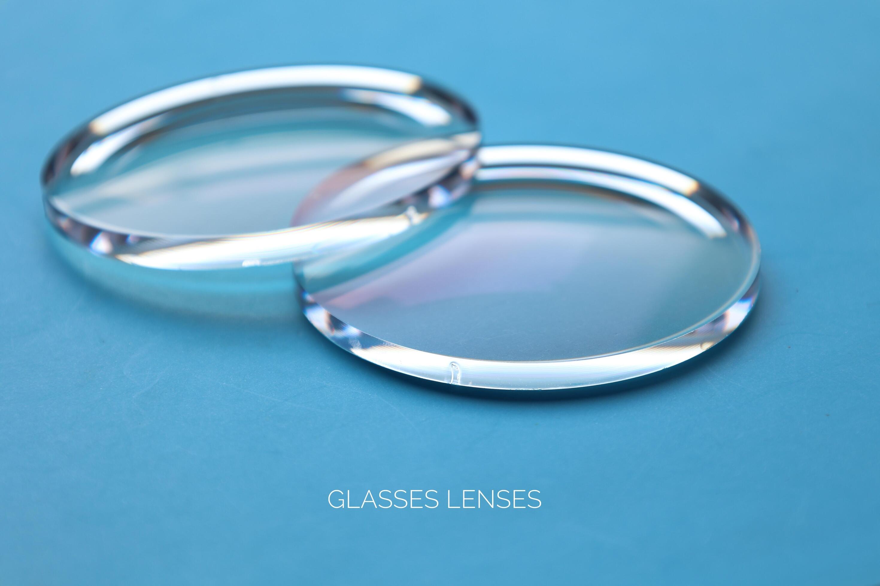 Eyeglasses lens production industry, close-up eyeglasses lenses, eyeglasses lenses, eyeglasses lenses, eyeglasses store business concept Stock Free