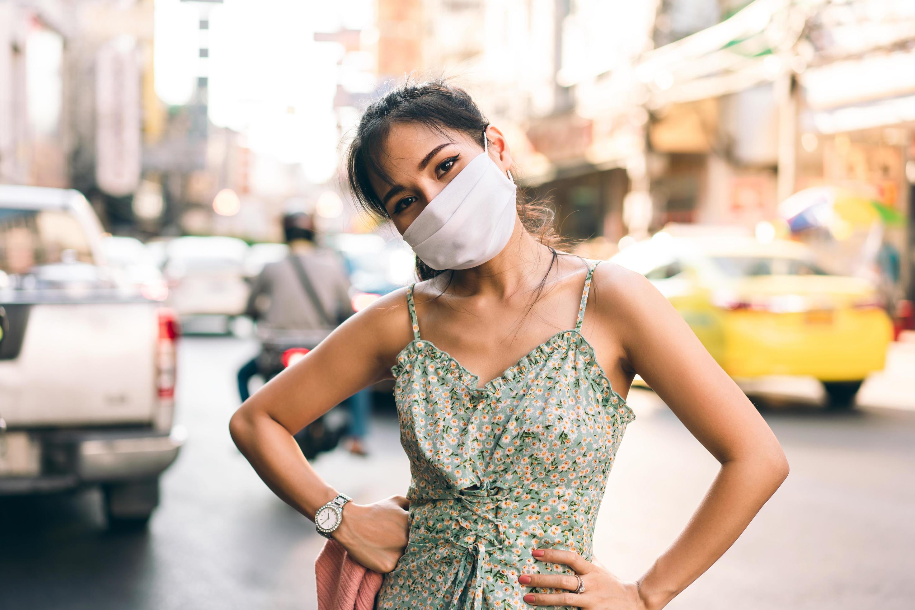 asian adult woman wear mask on face for public health new normal lifestyle protect corona virus Stock Free