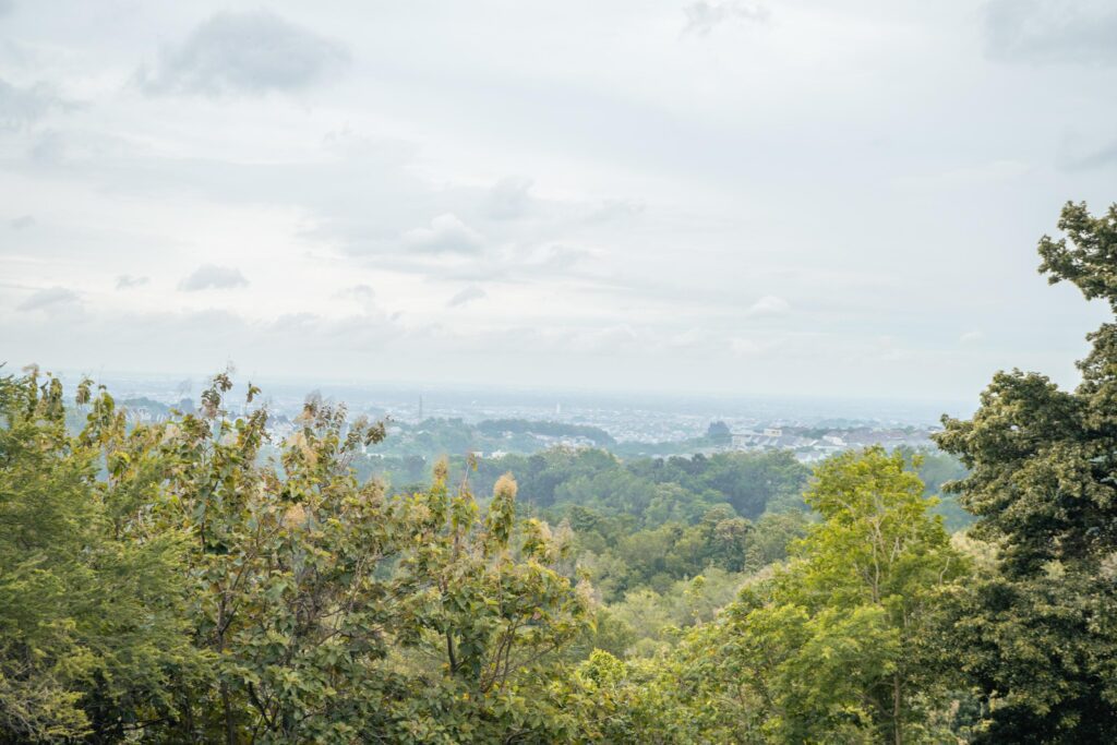 Landscape of hilltop with cloudy vibes when rain season. The photo is suitable to use for environment background, nature poster and nature content media. Stock Free