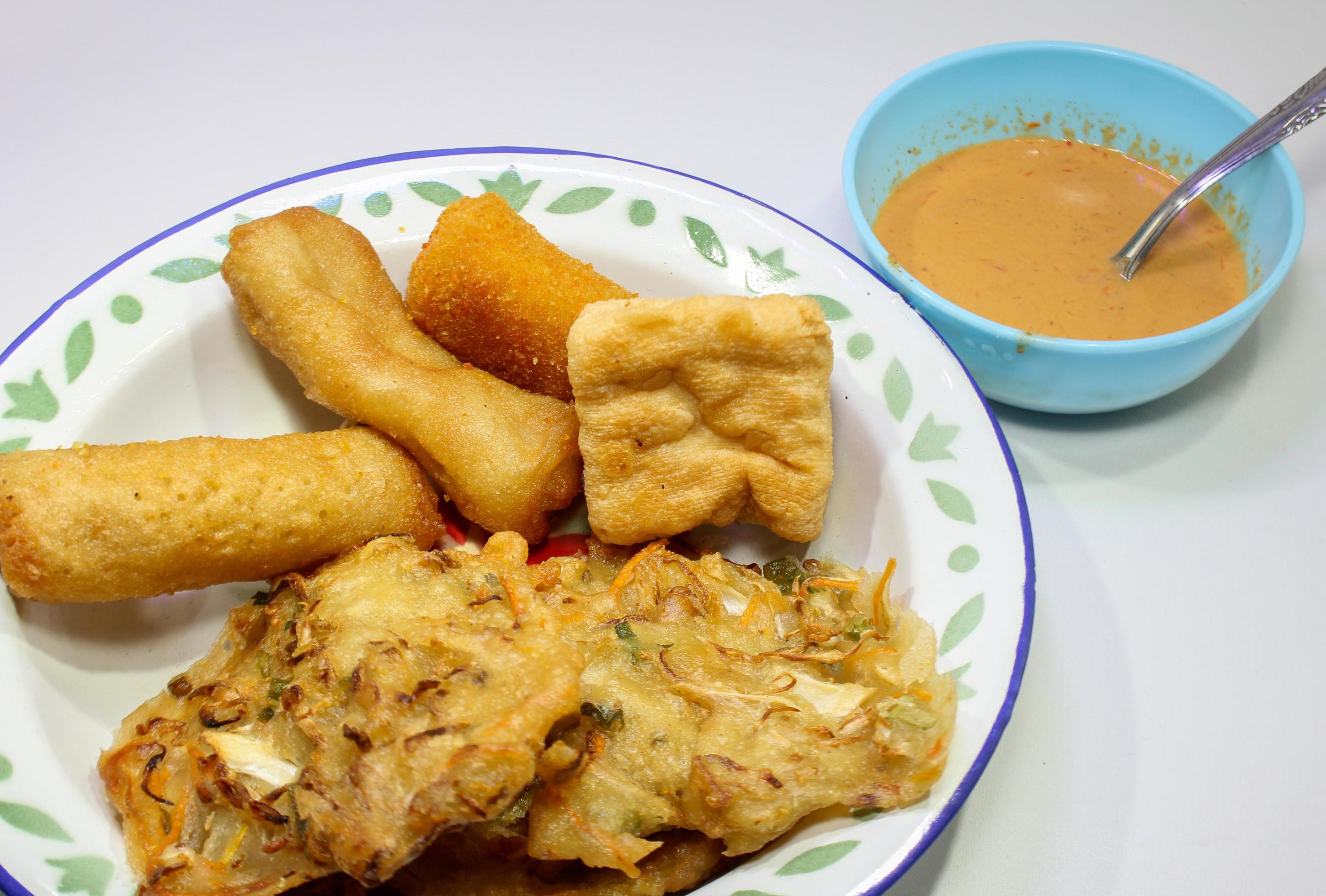 Gorengan is a typical snack from Indonesia. consisting of bakwan risol, tofu. This food is usually sold by street vendors at cheap prices. Stock Free