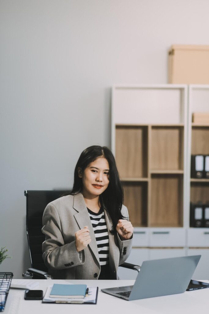 Happy executive sales business woman cheering excited in celebration after good news. achieving goals, success concept Stock Free