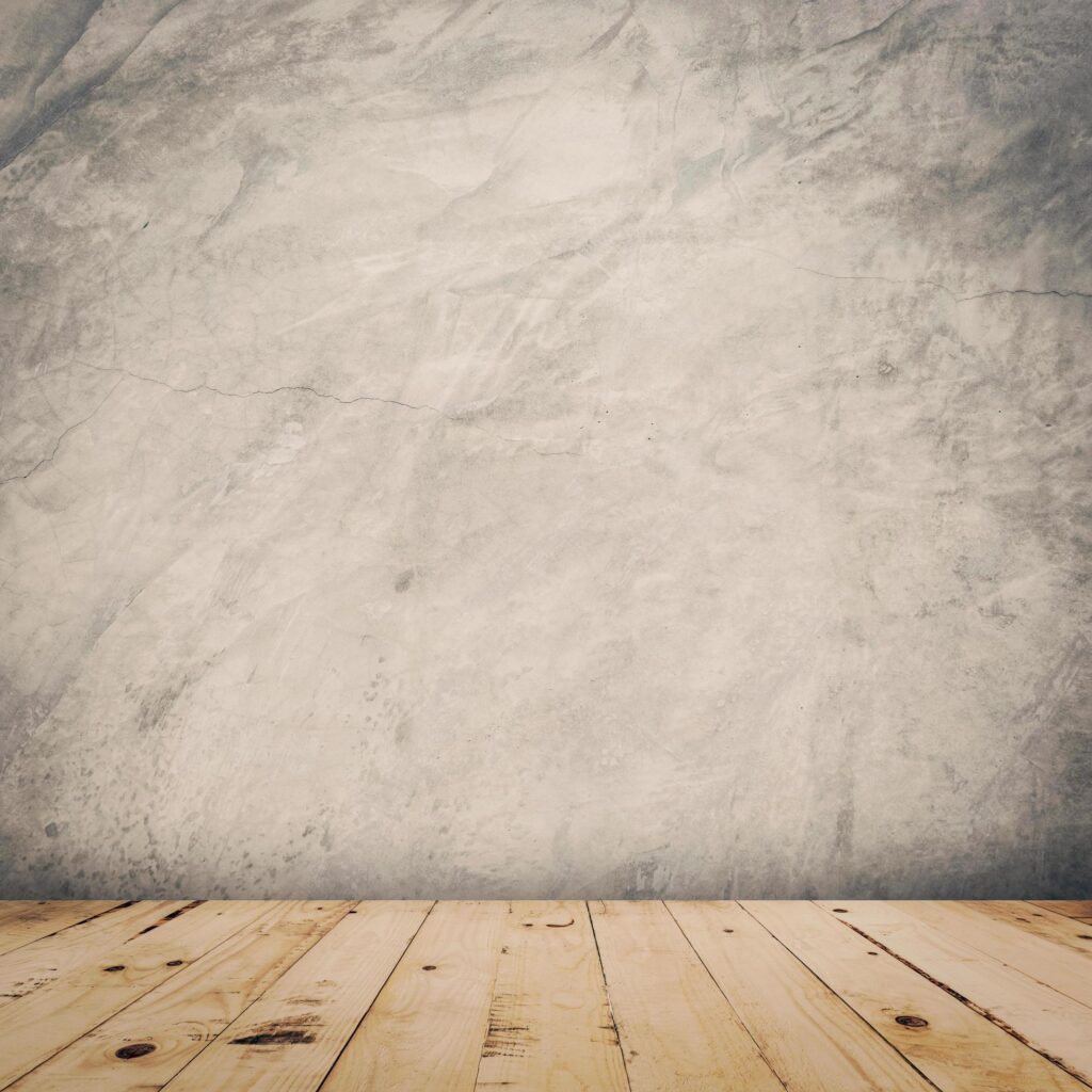 grunge cement wall and wood floor background and texture with space. Stock Free