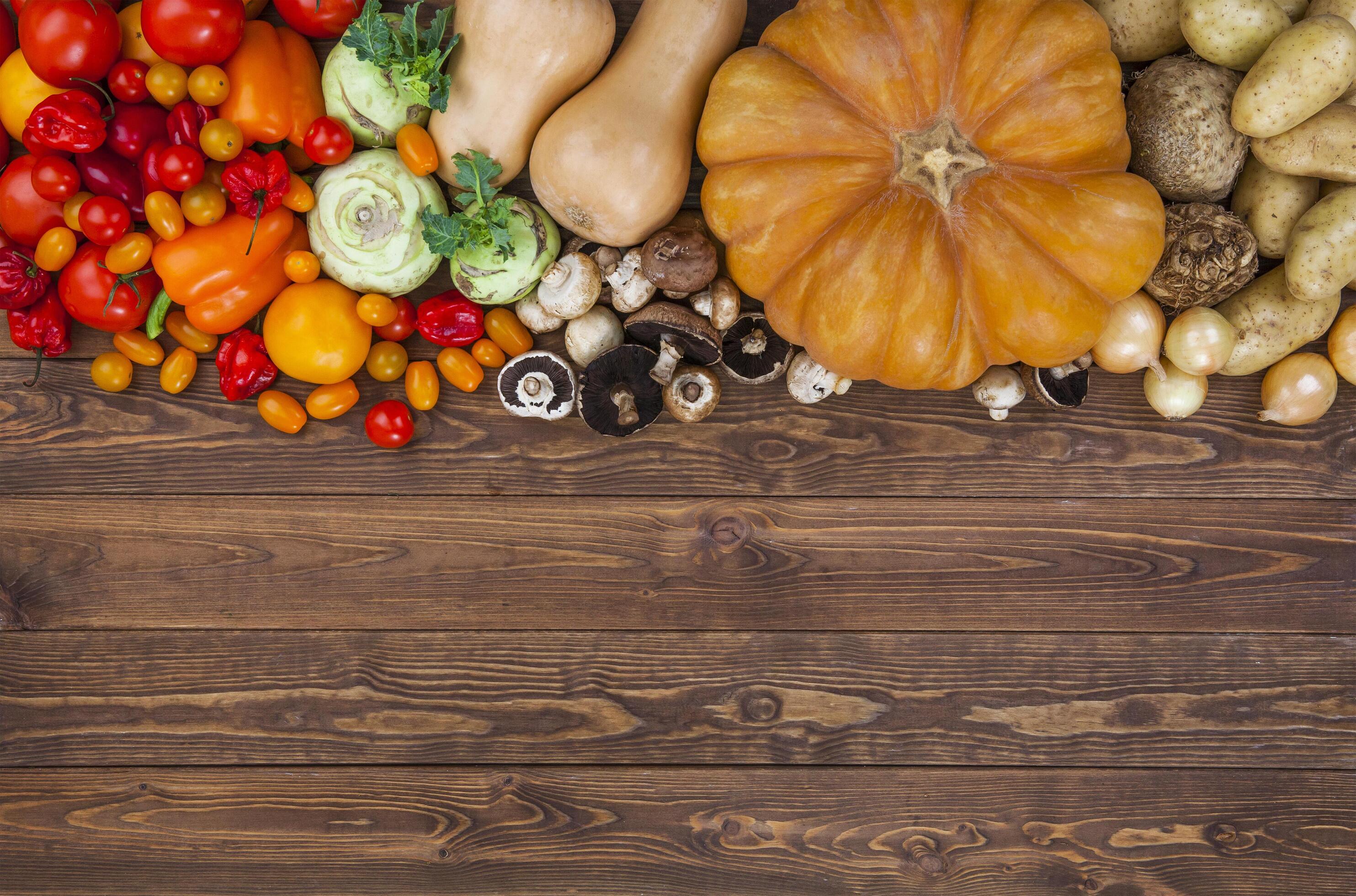 Harvest on wooden table background Stock Free