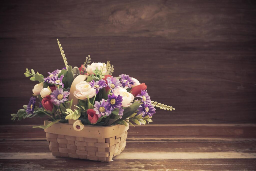 still life flower in basket on old wood Stock Free