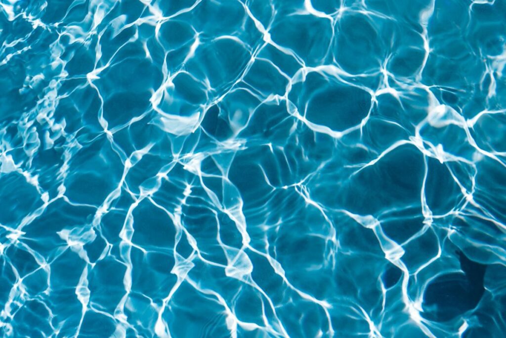 Wavy water surface in a swimming pool Stock Free