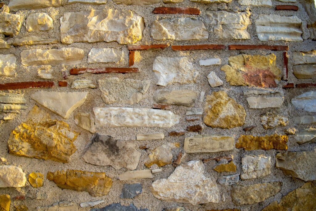 Ancient medieval stone wall texture background. Stock Free