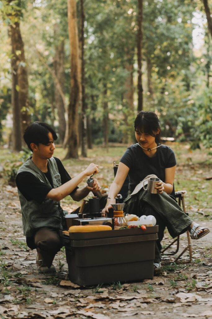 Asian couple sweet in tent inside on they camping trip, traveller relax and sleep togather in out door and camping trip Stock Free