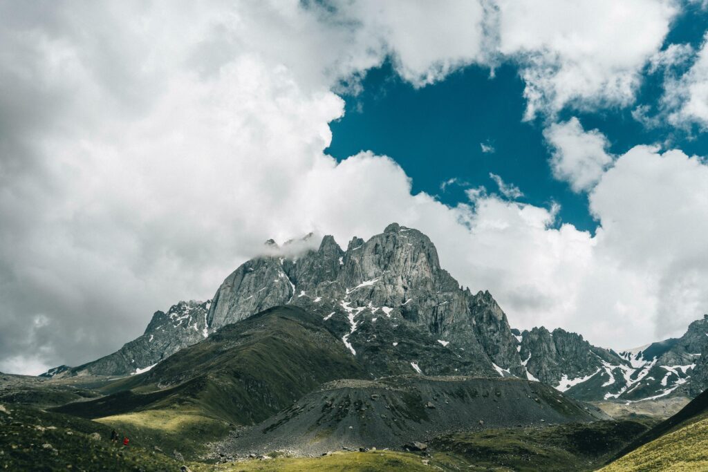 Mountain landscape with Epic view . Beautiful sky and rocks, Photo high quality, Background for display, nature theme, cumulus clouds Stock Free