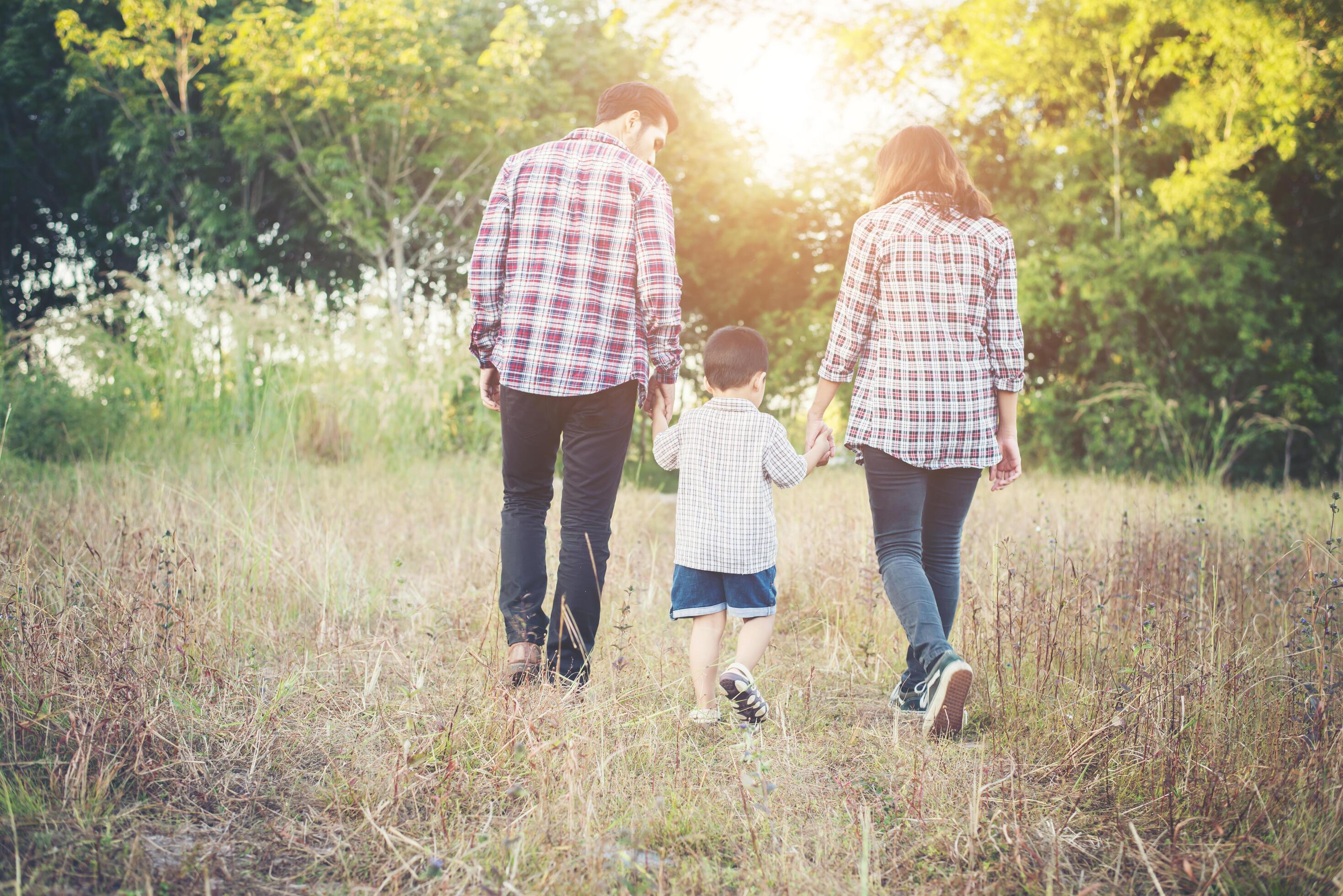 Young family spending good time together. Family outdoors in love. Stock Free