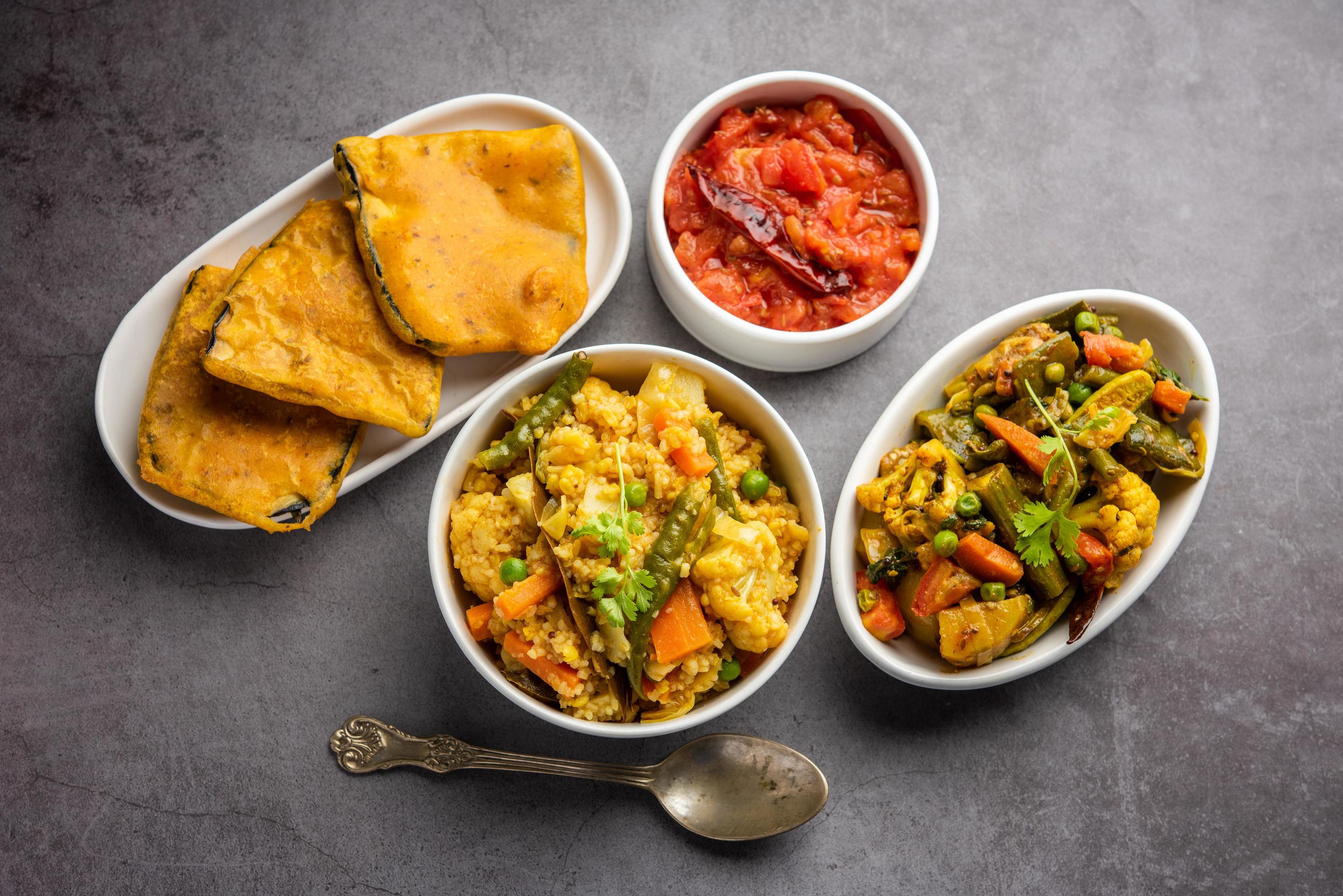 Bengali Bhog food for Indian Hindu Durga Puja or pooja festival. Khichadi, labra, tomato chutney Stock Free