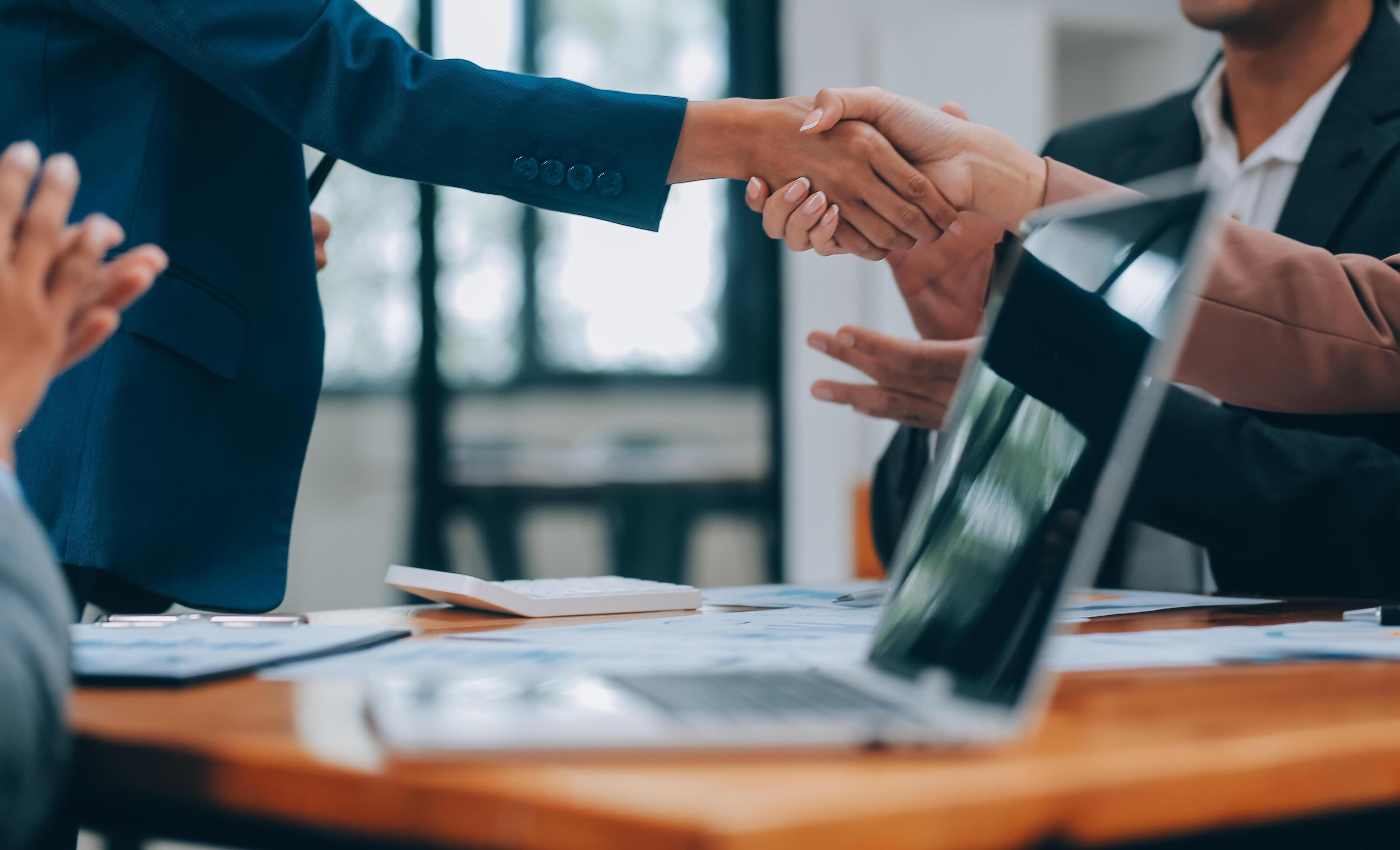 Business people shaking hands, finishing up meeting Stock Free