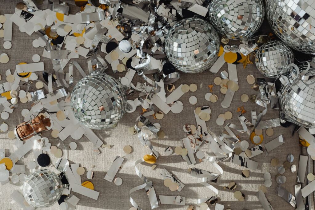 New Year’s Eve party mess – confetti – disco balls Stock Free