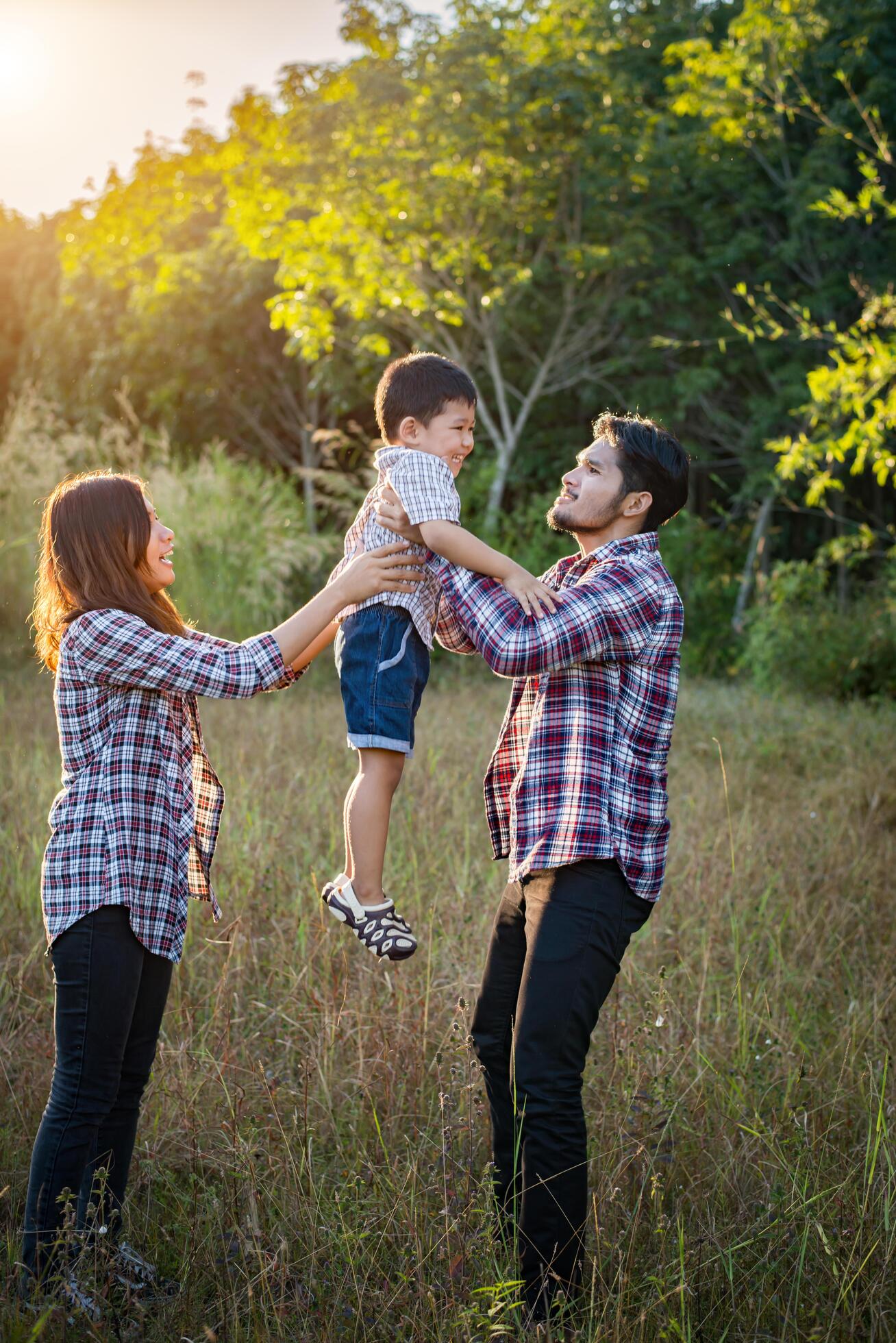 Happy young family spending time together outside. Family love concept Stock Free