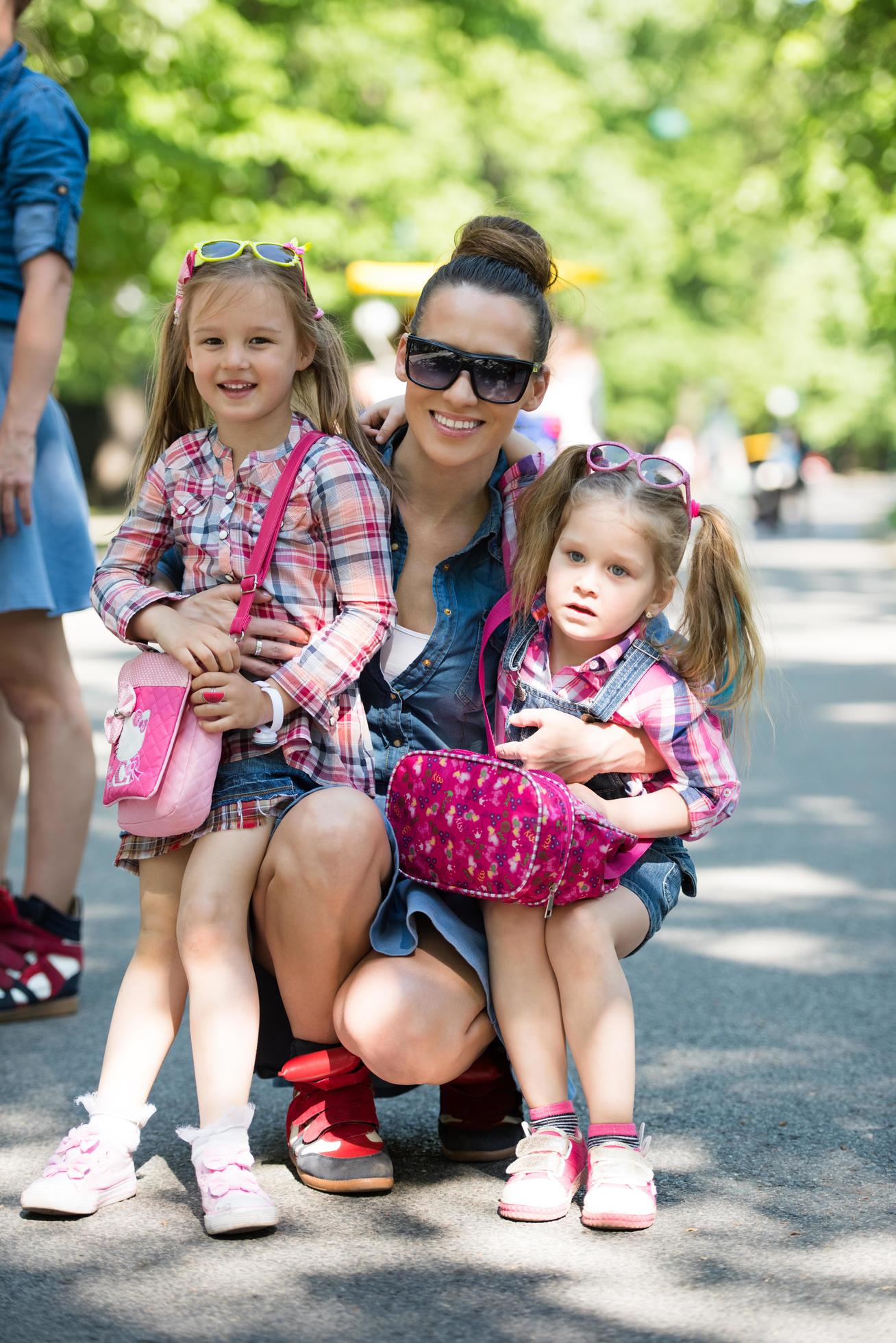 mother with her daughters in the park Stock Free