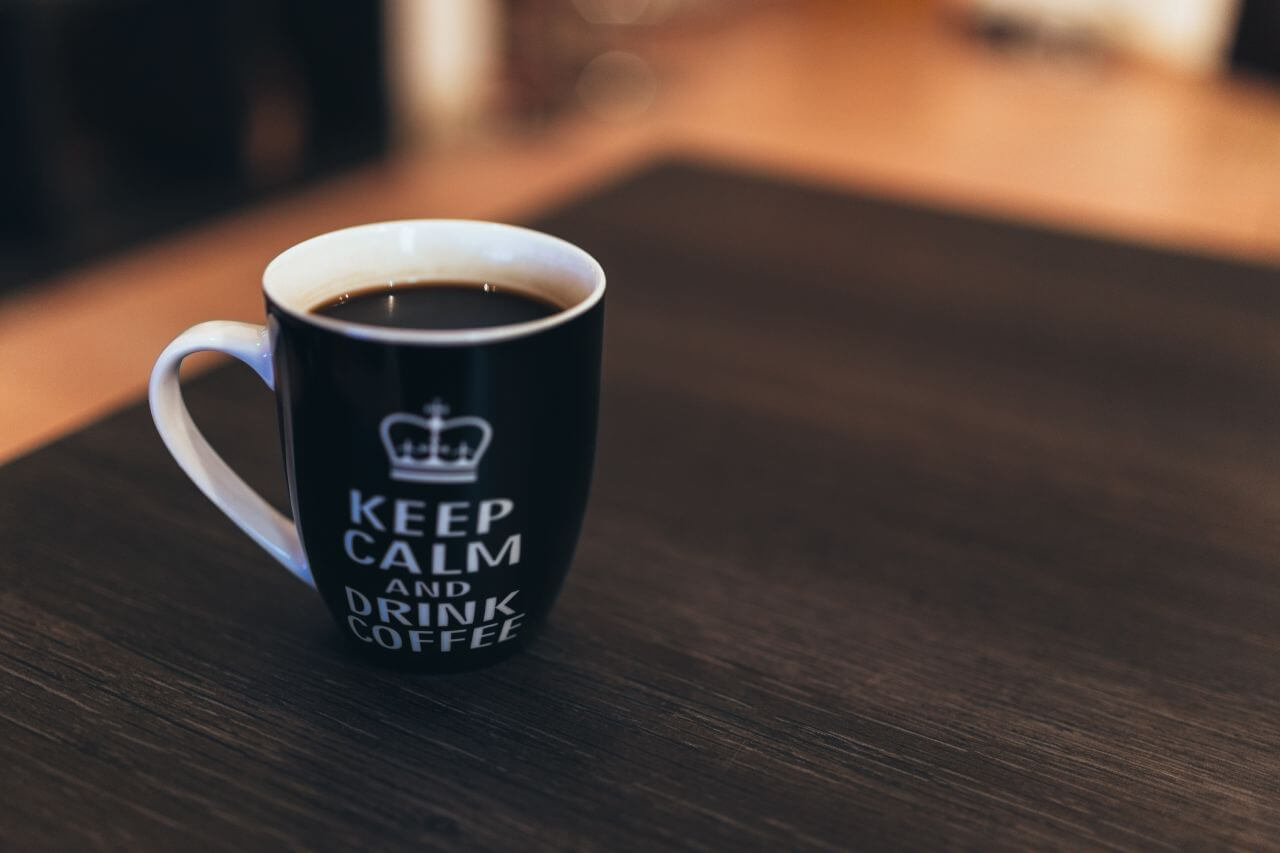 Black & White Coffee Mug on Desk Stock Free