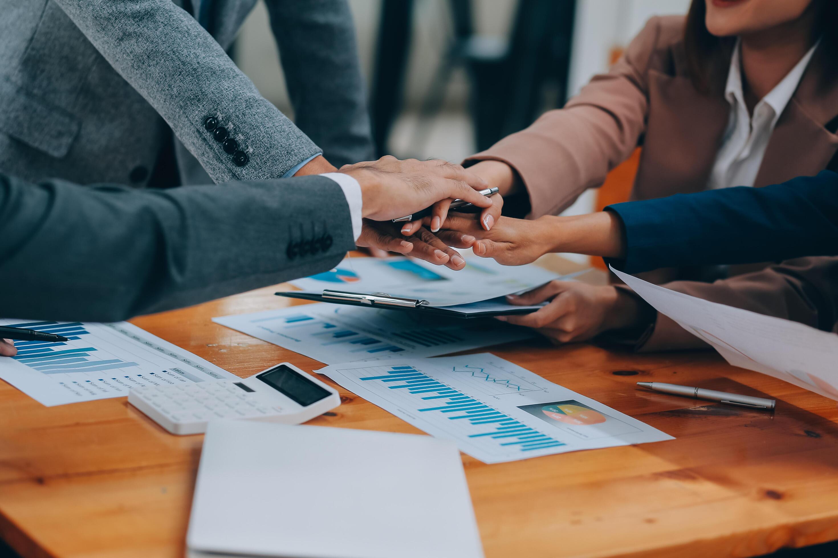 Business people join hand together during their meeting Stock Free