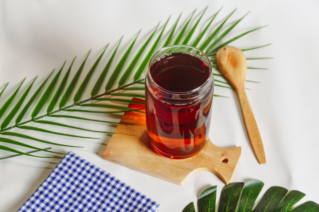 photography of a glass of tea and several elements on a white background Stock Free