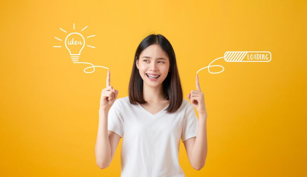 Woman Pointing hands to light bulb Stock Free