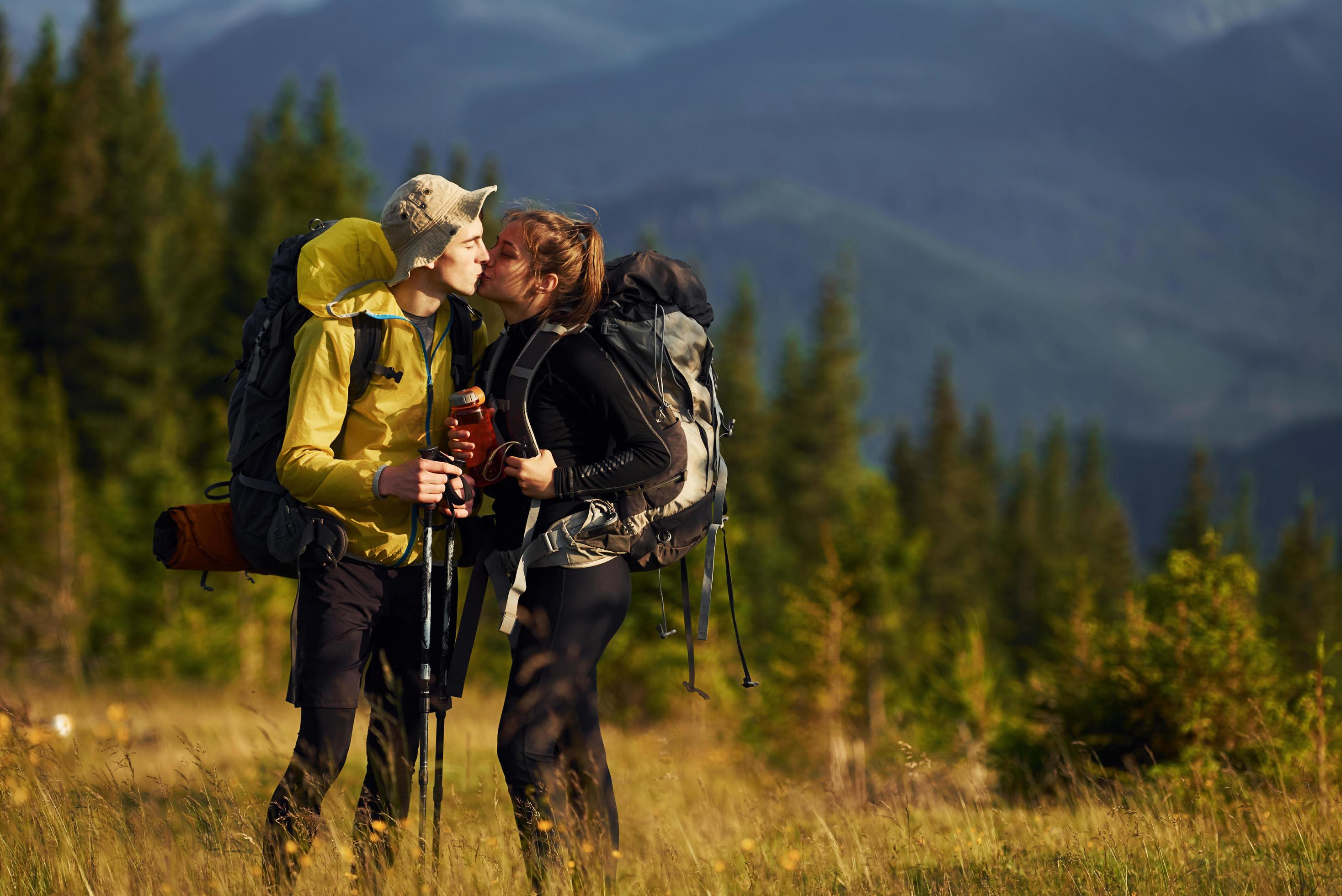 Cute young couple. Majestic Carpathian Mountains. Beautiful landscape of untouched nature Stock Free