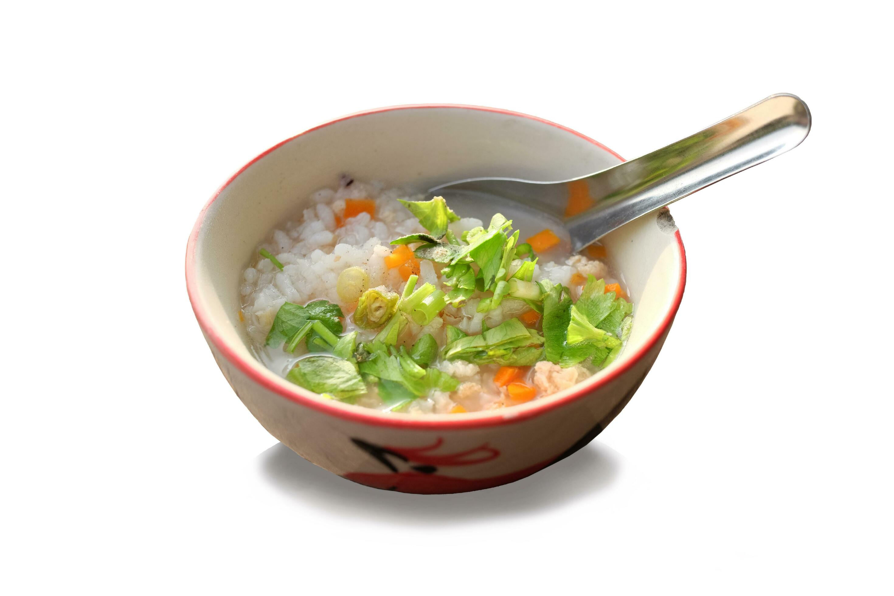 Rice with onions and carrots topping in bowl isolated on white background. Homemade Thai cooking is tradition food breakfast in Thailand Stock Free