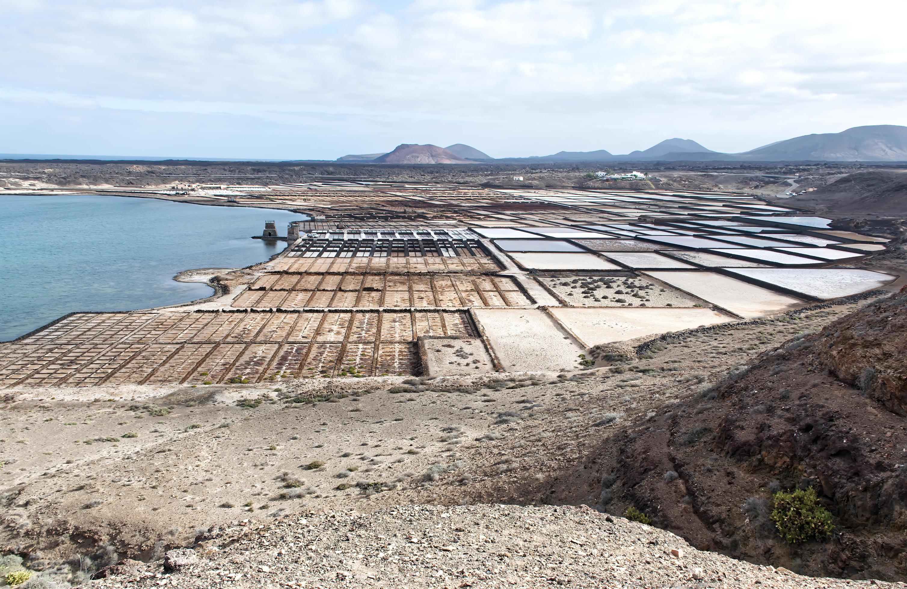 Natural salt evaporation pond on the island of Lanzarote at Salinas de Janubio, Canary Islands, Spain Stock Free