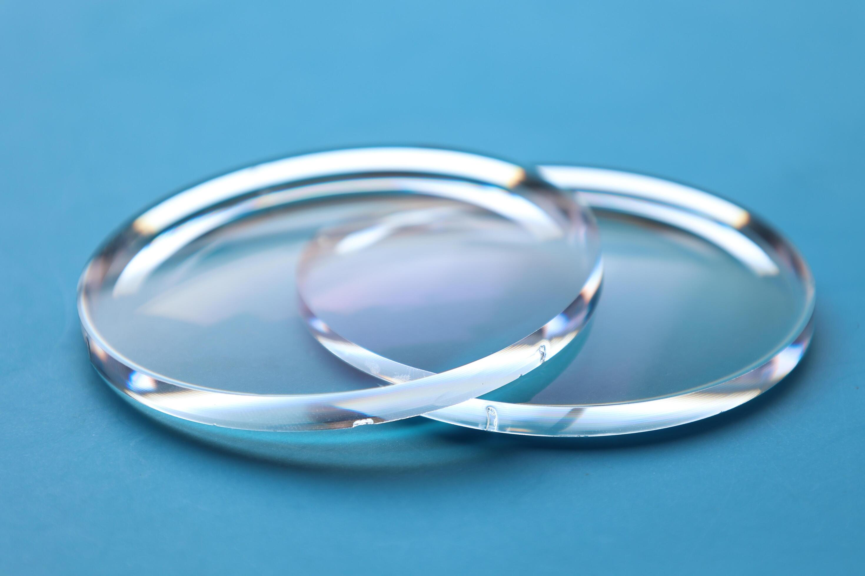 Eyeglasses lens production industry, close-up eyeglasses lenses, eyeglasses lenses, eyeglasses lenses, eyeglasses store business concept Stock Free