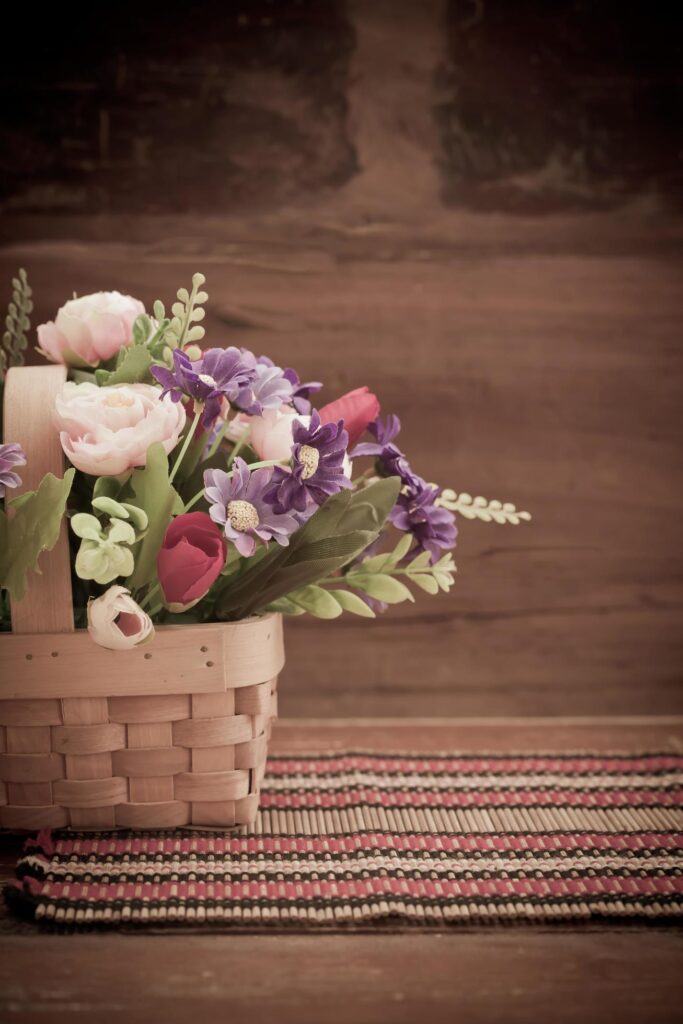 still life flower in basket on old wood Stock Free