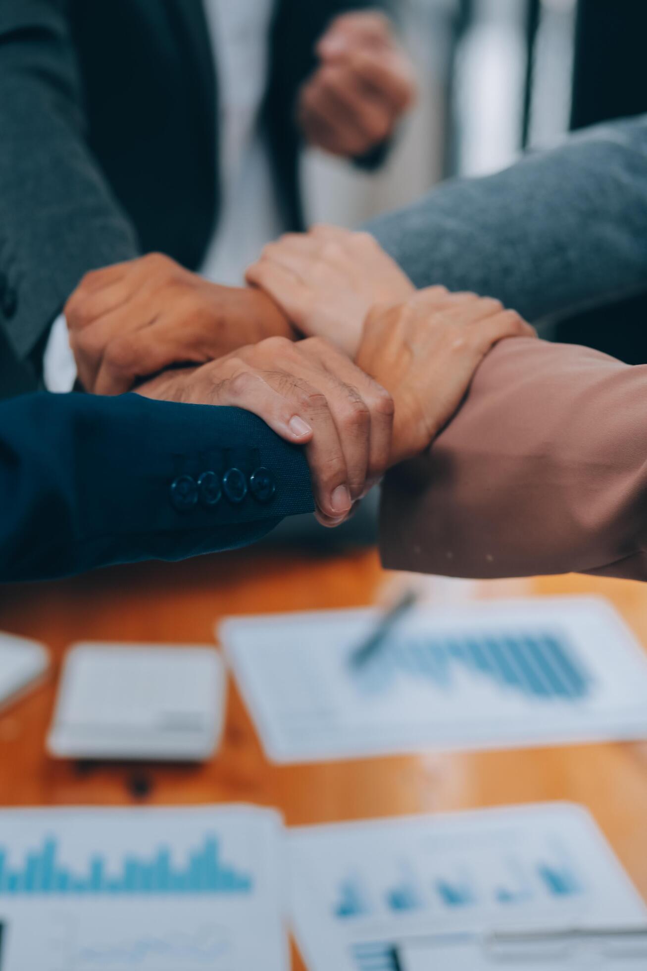 Business people join hand together during their meeting Stock Free