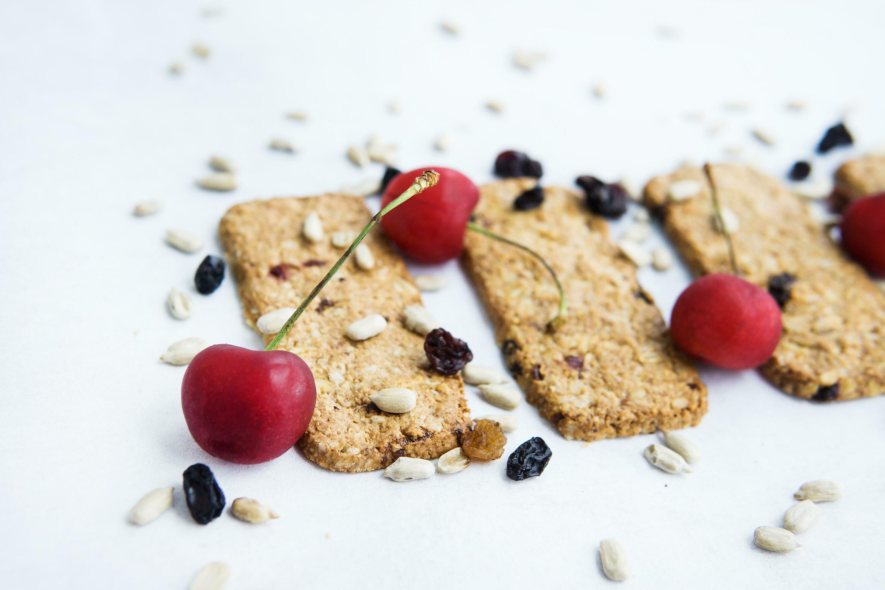 Granola cookies with raisins, cherries and seeds. Healthy sweet dessert. Healthy and healthy food. Homemade food, cooking at home. Stock Free