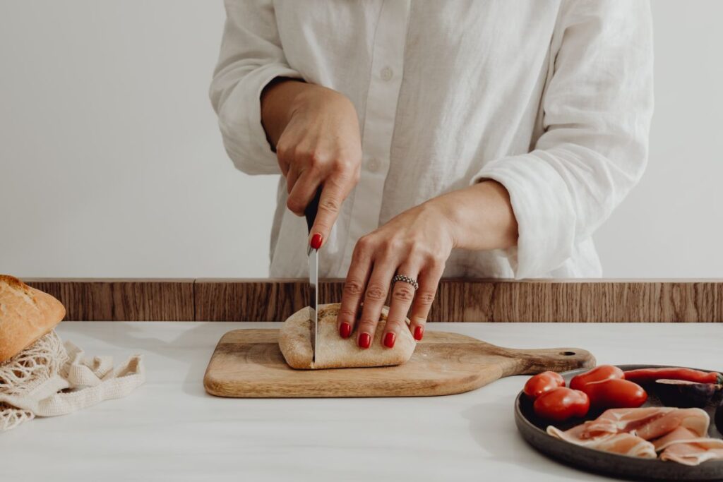 Woman making bruschetta with healthy ingredients Stock Free