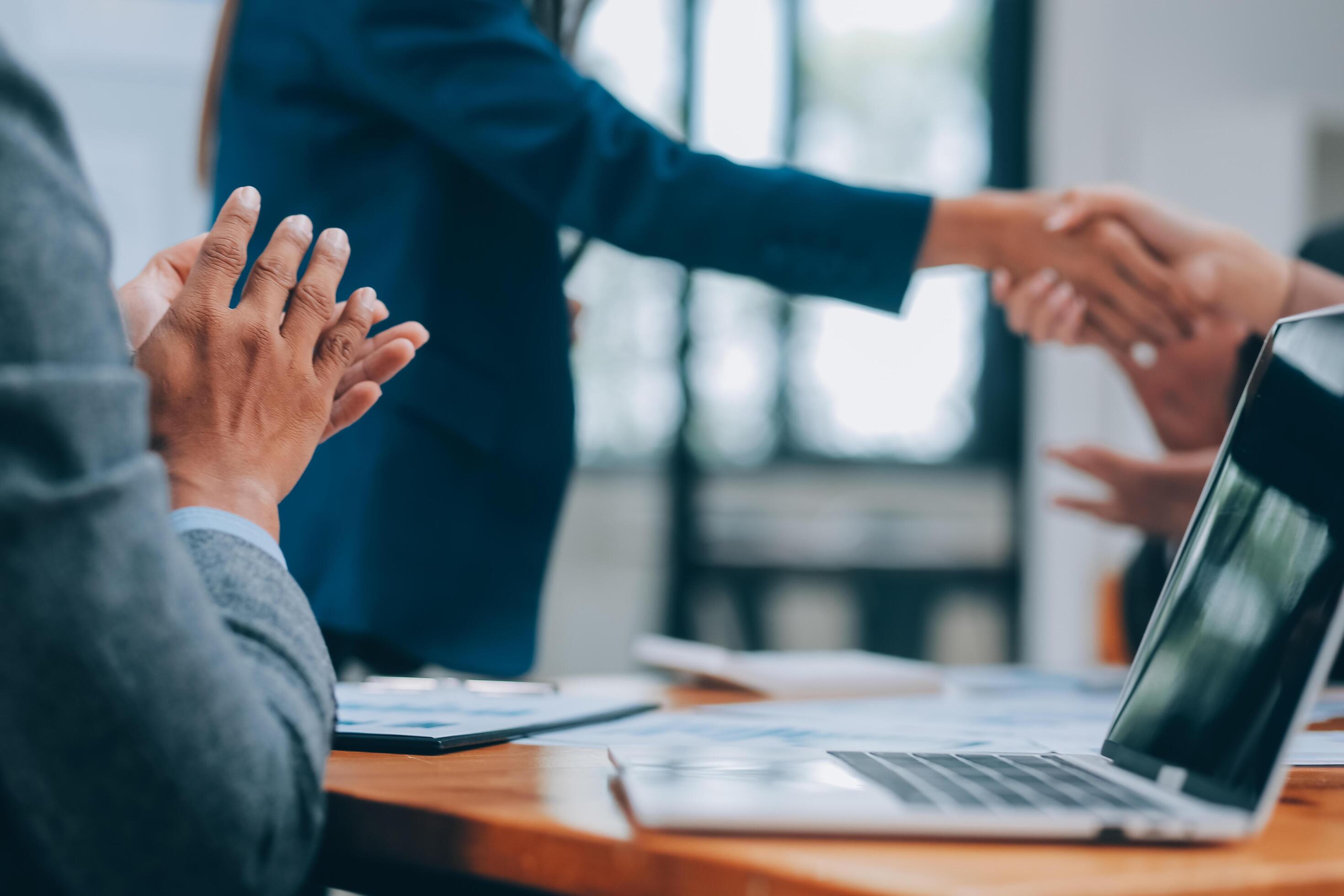 Business people shaking hands, finishing up meeting Stock Free