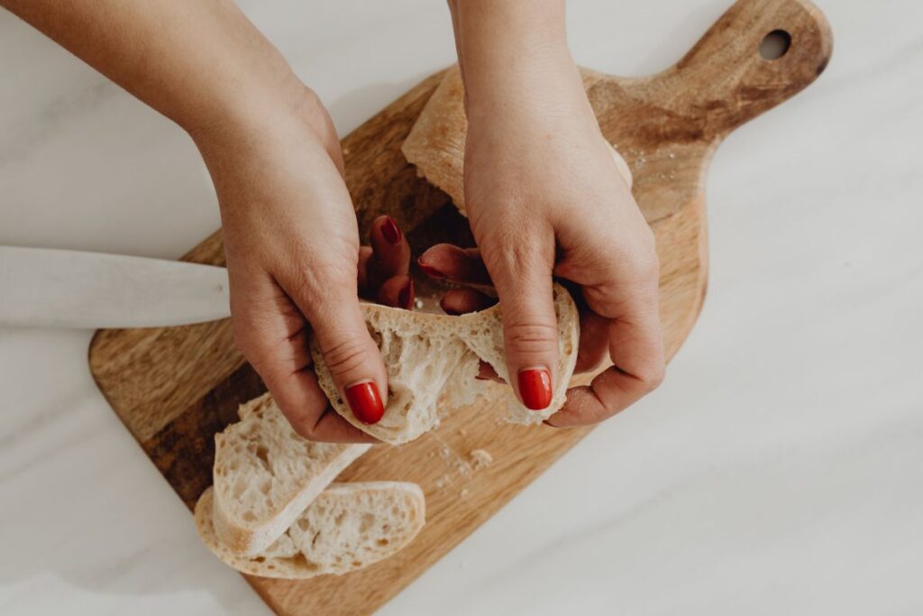 Woman making bruschetta with healthy ingredients Stock Free