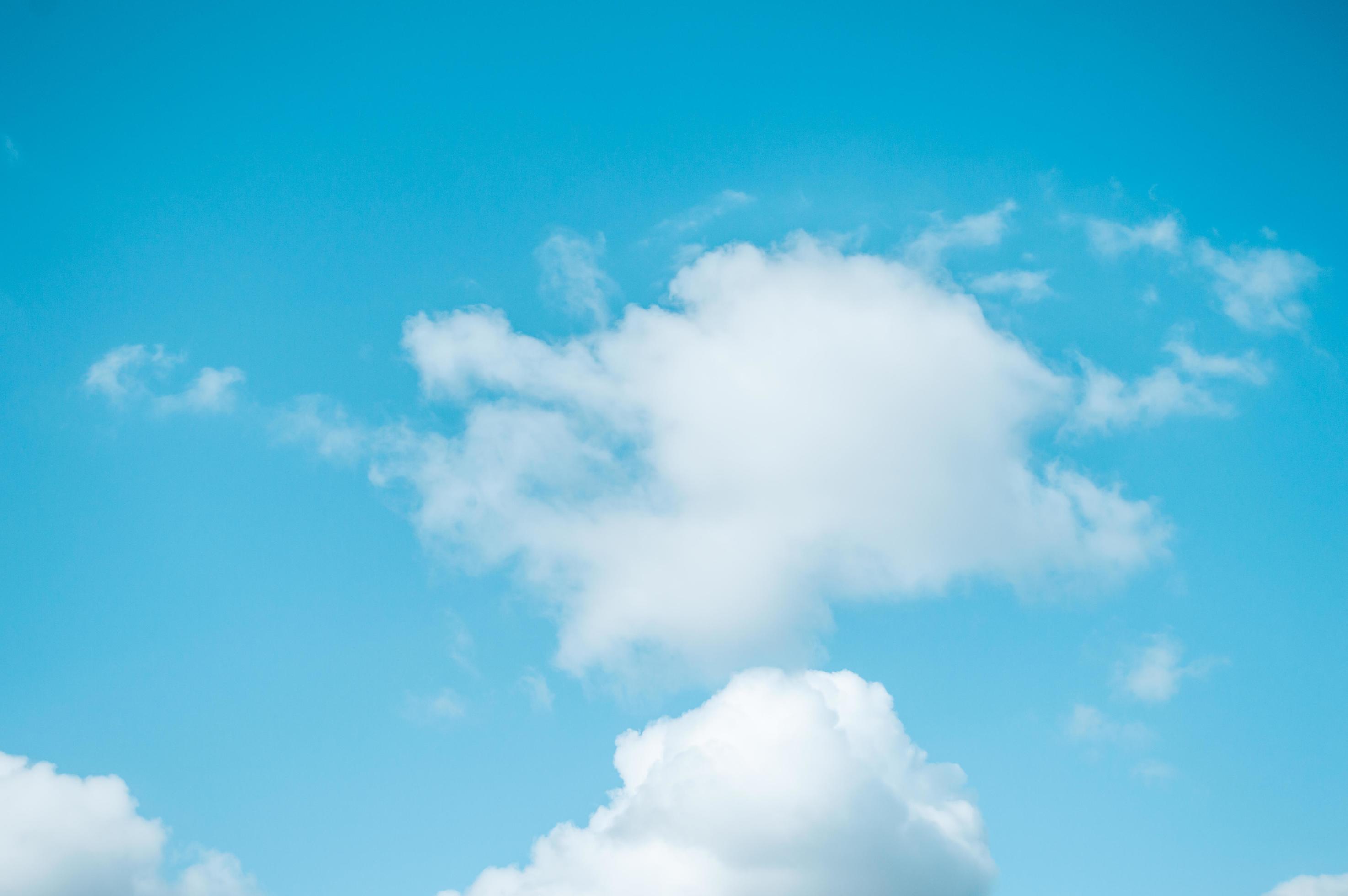 Blue sky with white fluffy clouds Nature background Stock Free