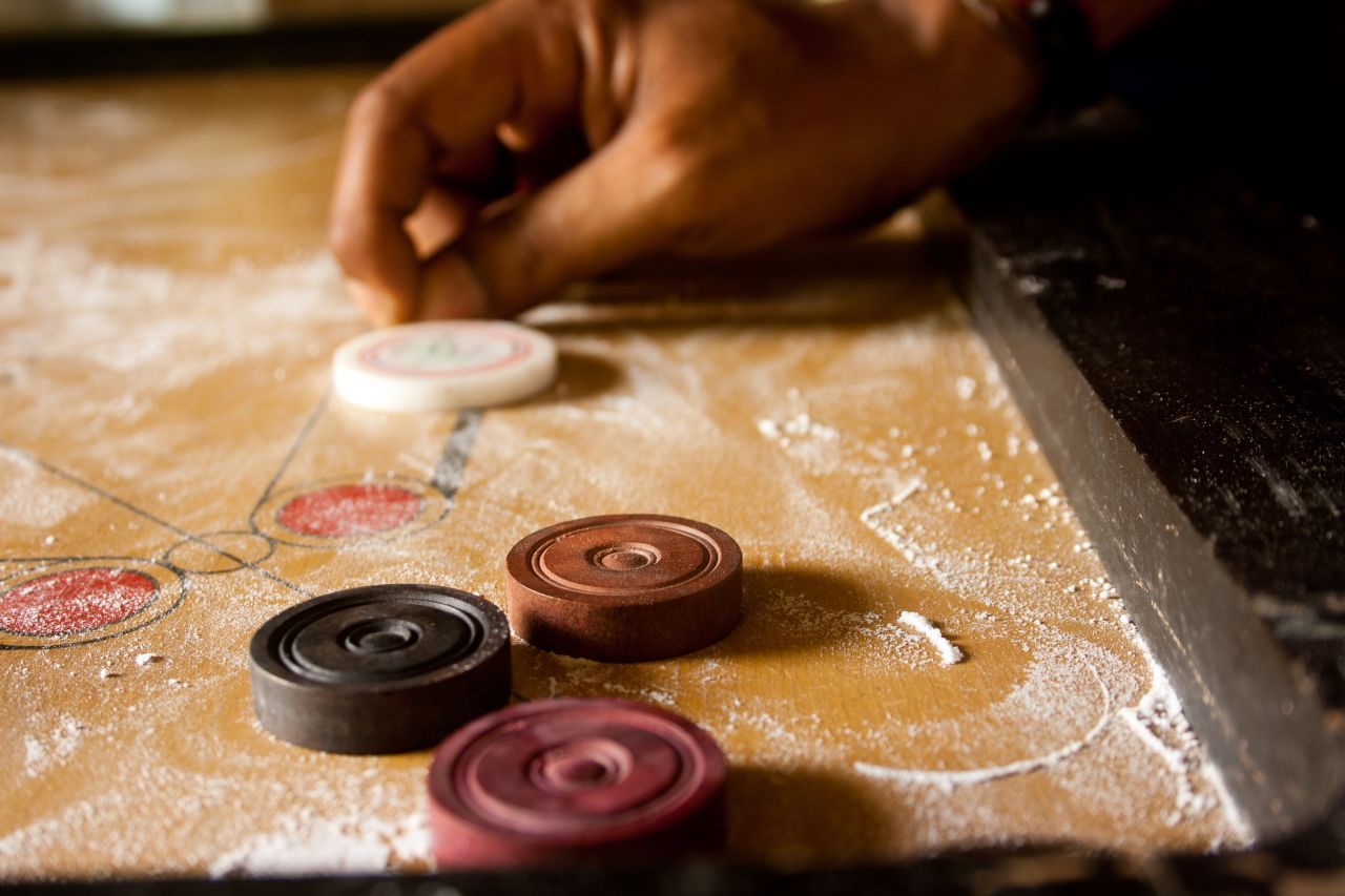 Playing Carrom Shot Stock Free