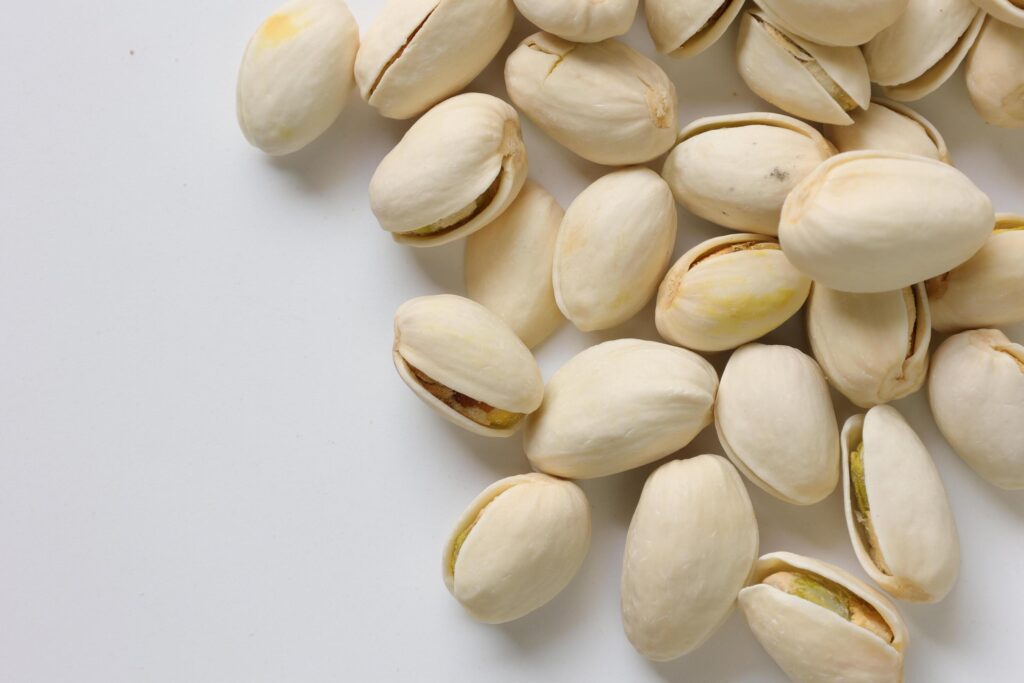 Pistachios nuts seeds on white background Stock Free